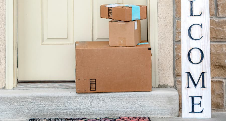 Deliveries on the front porch of a house with a welcome sign in Reno